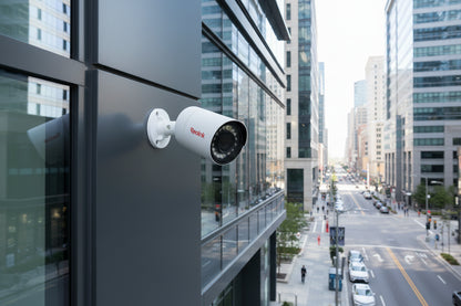 Security camera system with eight cameras and a DVR on a dark background