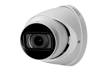 White security camera with black lens on a white background