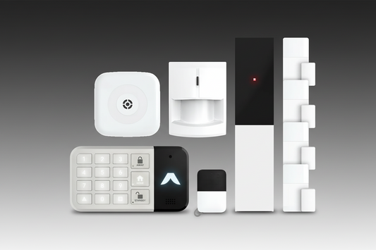 Set of security system components including a keypad, camera, and sensors on a white background